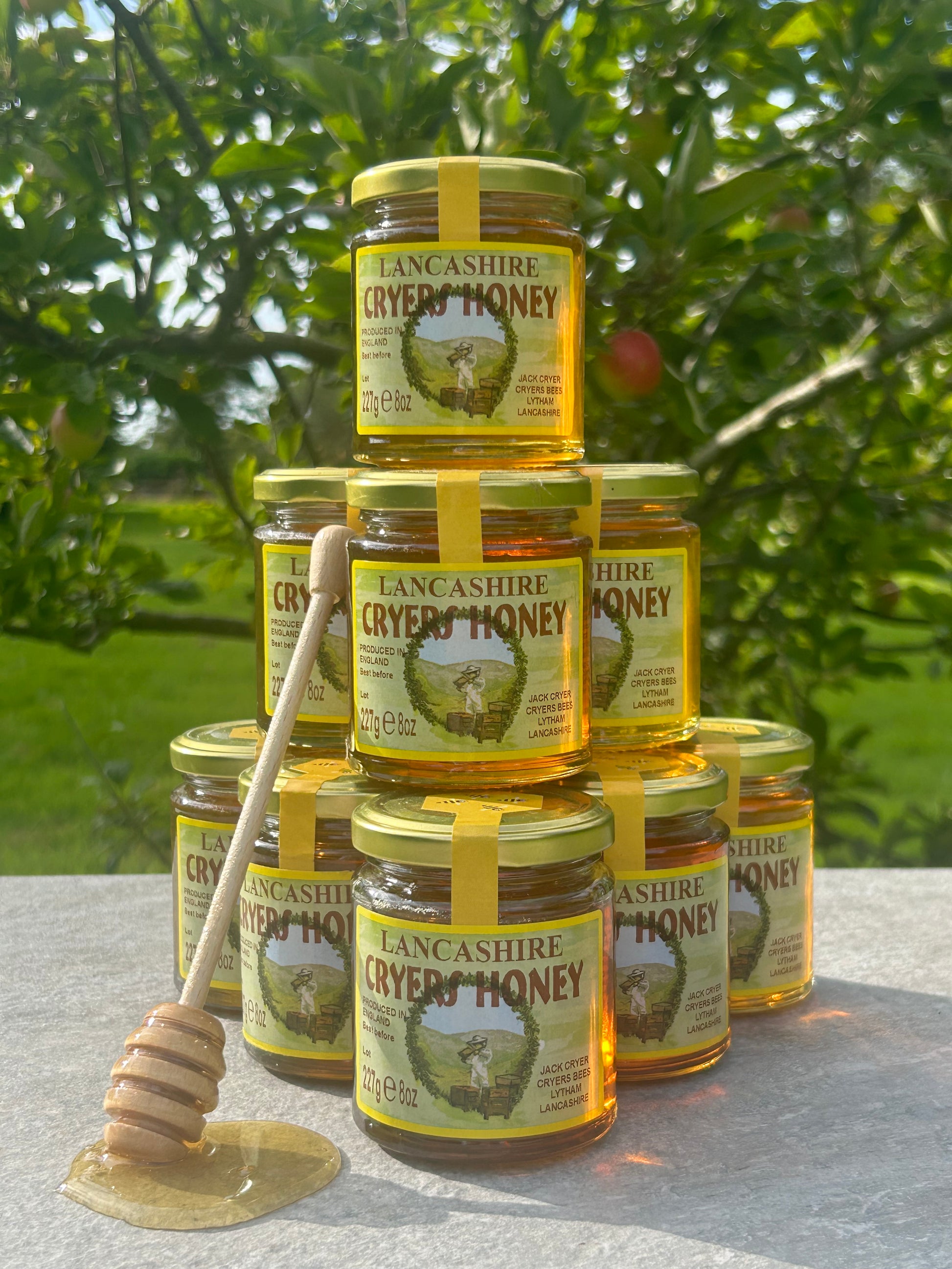 Multiple jars of Lancashire Honey stacked together, emphasizing the availability of this locally sourced product.